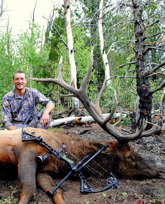 Trail Kreitzer with archery bull elk taken off a wallow