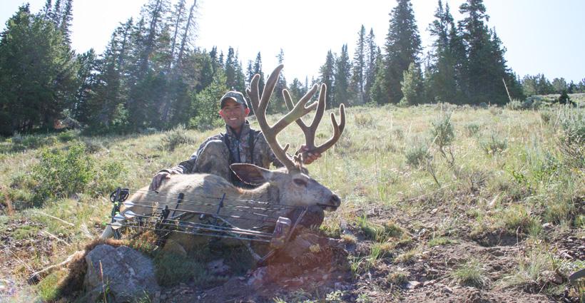 Eric Baler with an archery mule deer