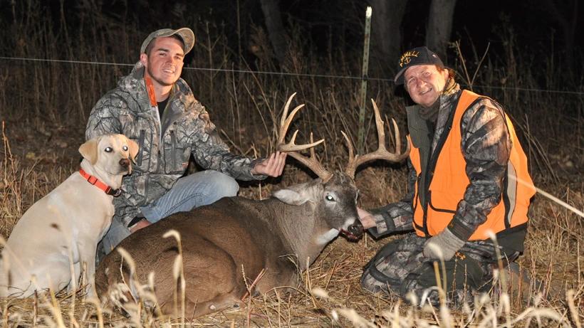 Stephen spurlock and his dad with a whitetail buck