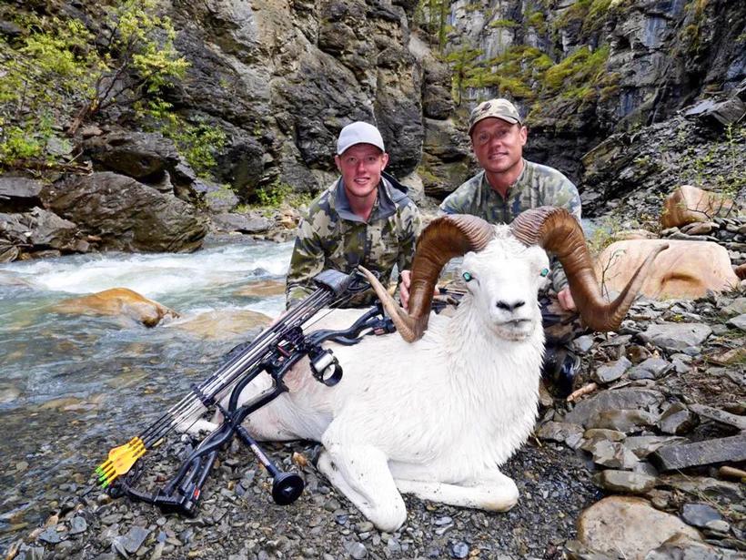 Nathan French guiding a client to an archery dall sheep