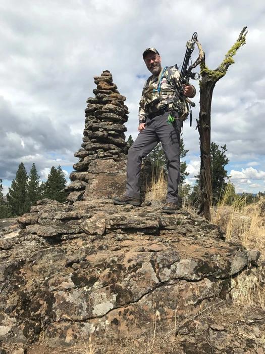 Hunter posing next to a cool sheep herder’s cairn during the 2017 archery season.