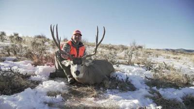 Brandon Evans with Colorado mule deer