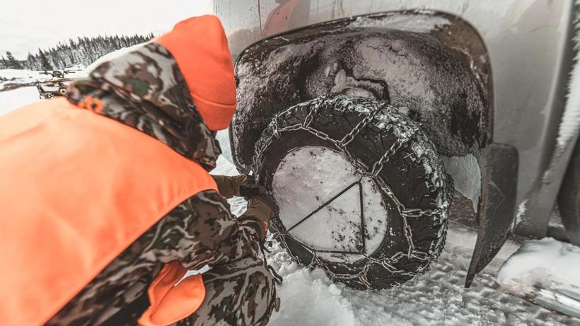 Adjusting tire chains while hunting late season