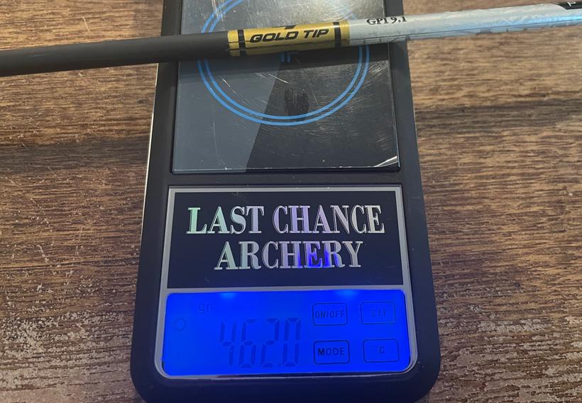 Weighing arrow on last chance archery scale