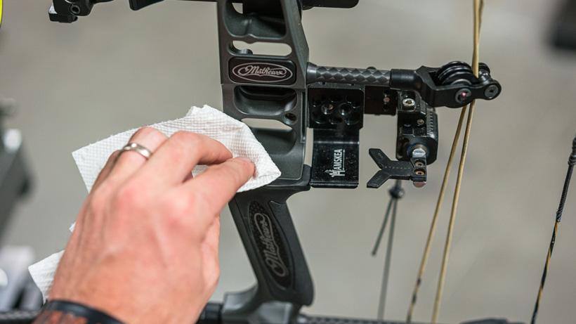 Applying small amount of acetone on bow riser