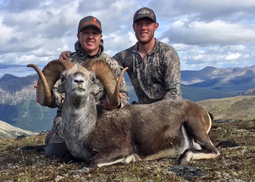 Nathan french and robert bentley with a stone sheep