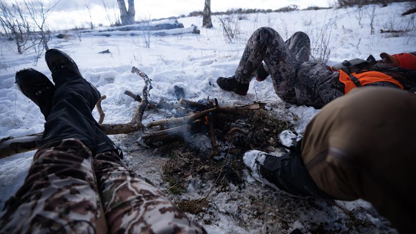 First lite sitting by campfire