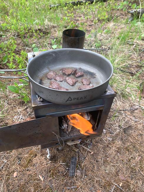 Cooking up bear meat on a backcountry stove