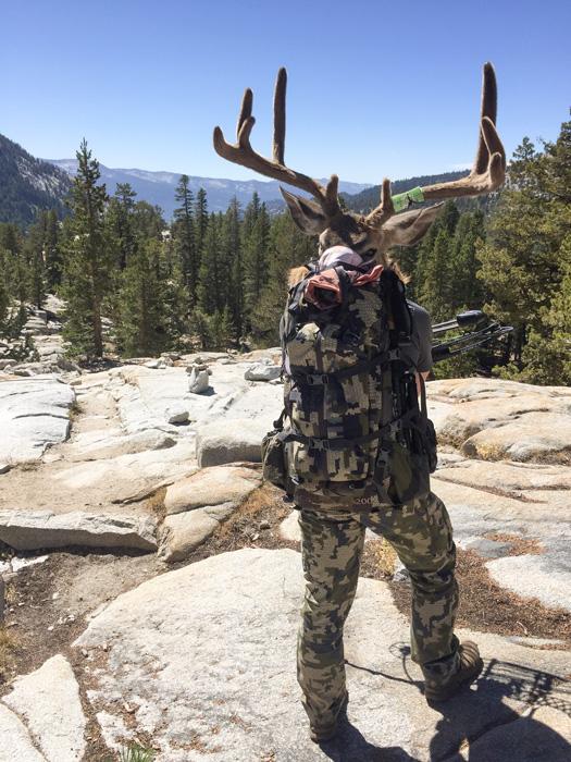 Travis stone packing out his archery california blacktail deer