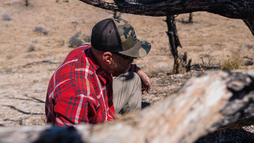 Jimmy tippetts in deep thought over a tree stump
