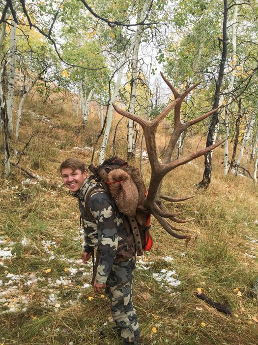 Bryton mecham packing out his utah bull elk