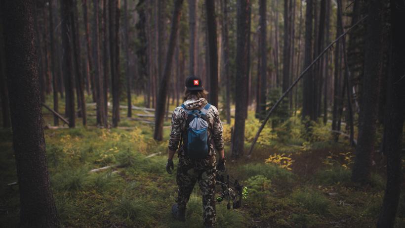 Nick elk hunt walking in woods