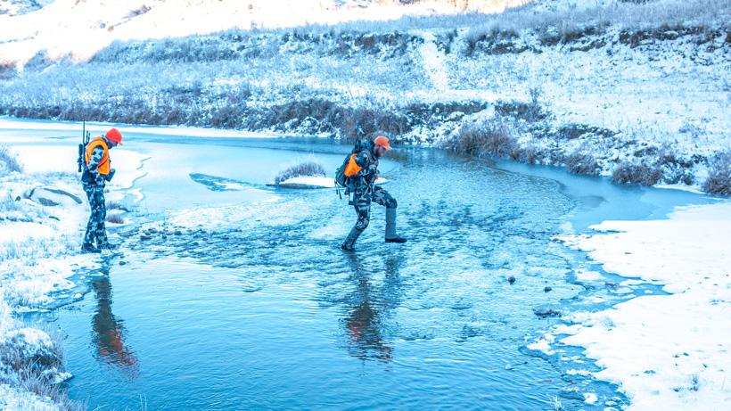 Stream crossing with boot gaiters on a late-season cold weather hunt