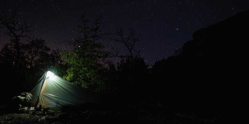 Tent at night in mountains