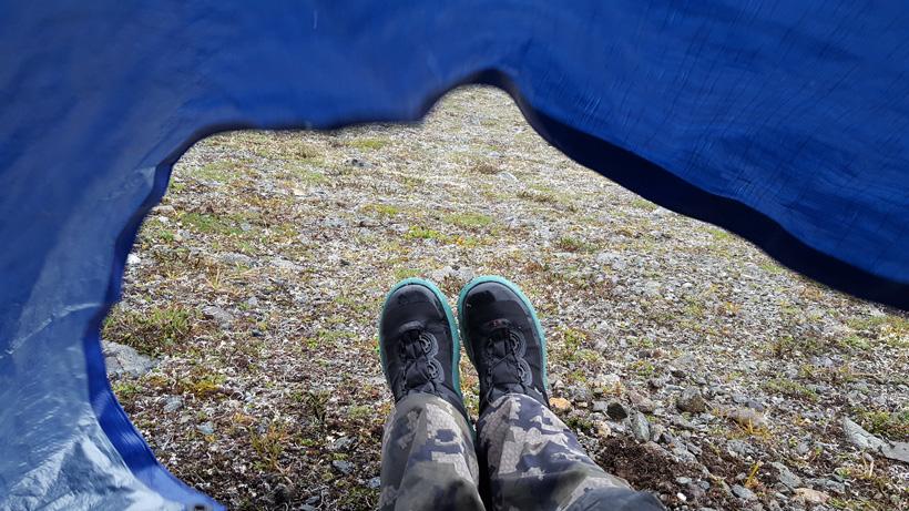Trying to stay dry under the tarp