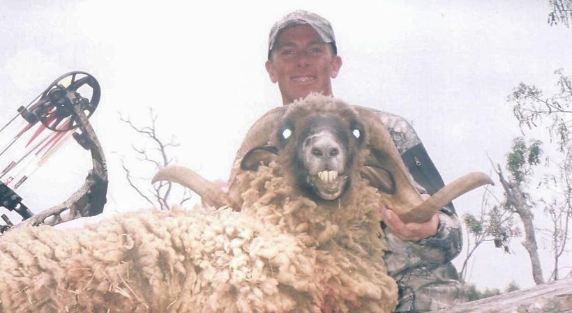 Eric Baler with a black Hawaiian sheep