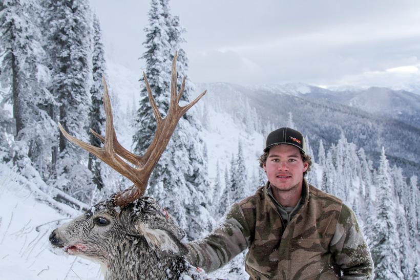 Easton enott with his high country montana mule deer