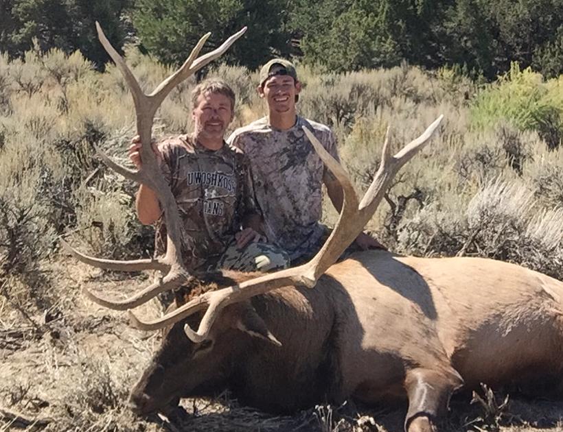 Todd Ruhland and his son with his 2016 Utah archery bull elk