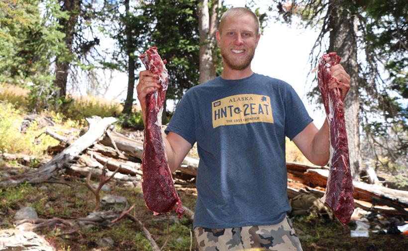 Darrick with mule deer meat