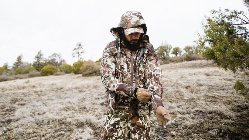 Josh kirchner putting on first lite stormlight rain gear