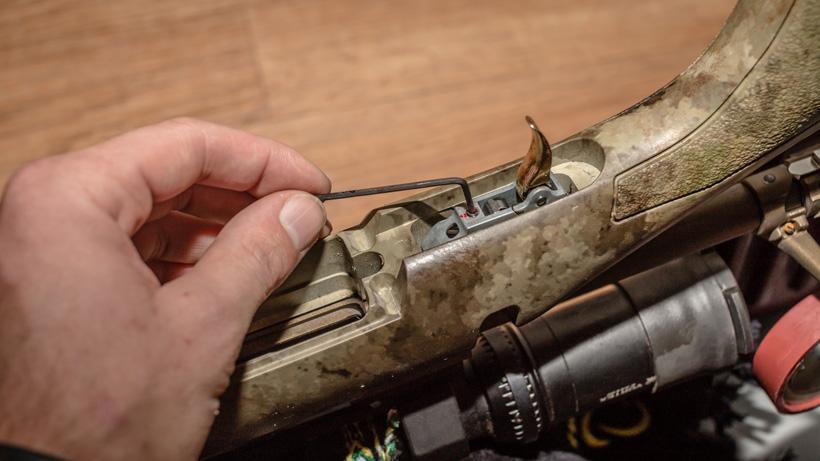 Adjusting a hunting rifle trigger tension screw