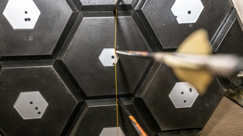 Indoor close range archery target practice shooting at string