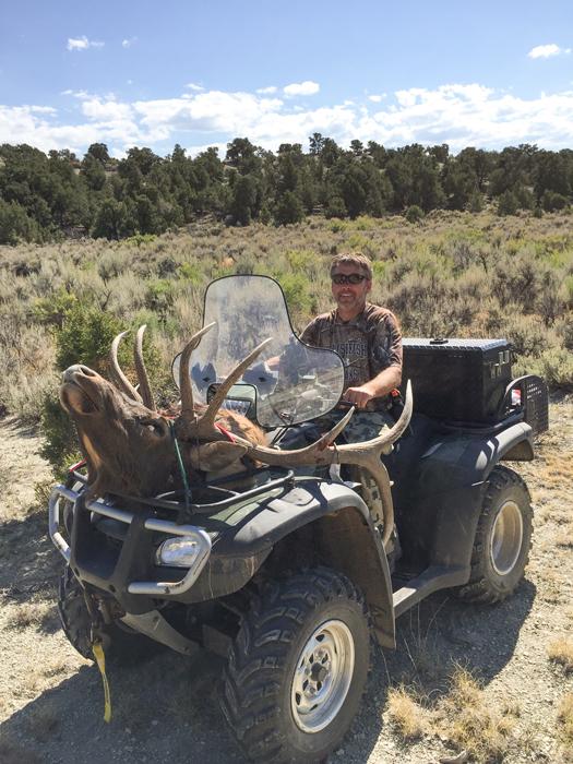 Hauling elk back on ATV
