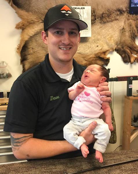 Dave barnett at the archery shop with his daughter