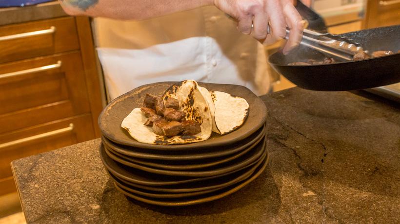 Adding elk meat to tortillas